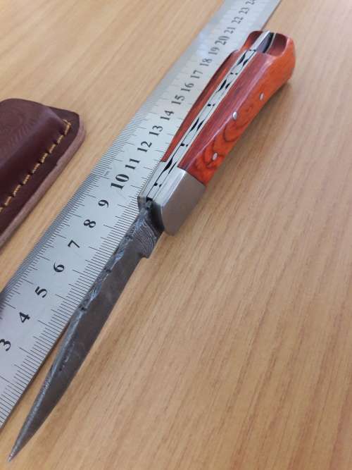Handmade Damascus steel folding knife with WOODEN handle scales.