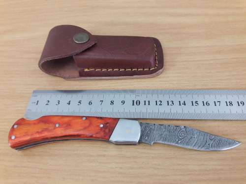 Handmade Damascus steel folding knife with WOODEN handle scales.