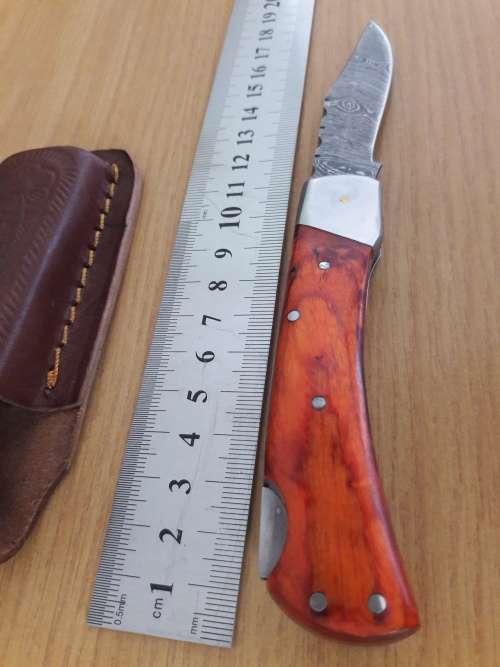 Handmade Damascus steel folding knife with WOODEN handle scales.