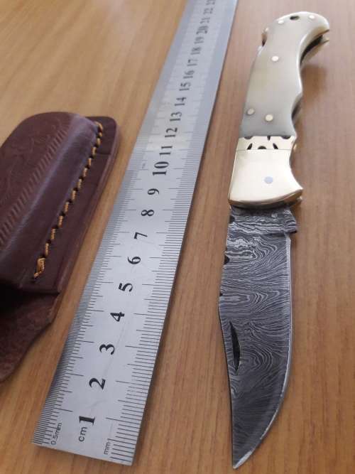 Handmade Damascus steel folding knife with CAMEL BONE handle scales.