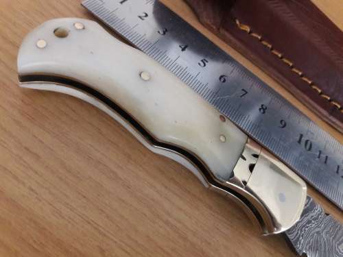 Handmade Damascus steel folding knife with CAMEL BONE handle scales.