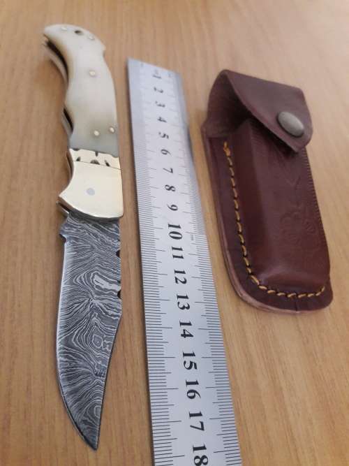 Handmade Damascus steel folding knife with CAMEL BONE handle scales.