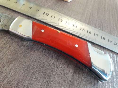 Handmade Damascus steel folding knife with Resin handle scales.