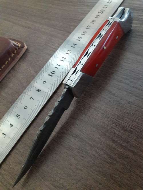 Handmade Damascus steel folding knife with Resin handle scales.