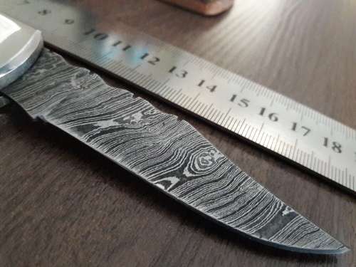 Handmade Damascus steel folding knife with Resin handle scales.