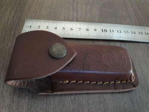 Handmade Damascus steel folding knife with Resin handle scales.