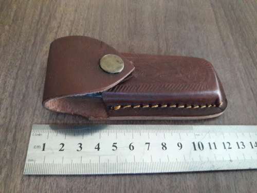 Handmade Damascus steel folding knife with Resin handle scales.