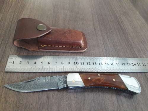 Handmade Damascus steel folding knife with Resin handle scales.
