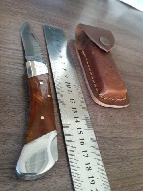 Handmade Damascus steel folding knife with Resin handle scales.