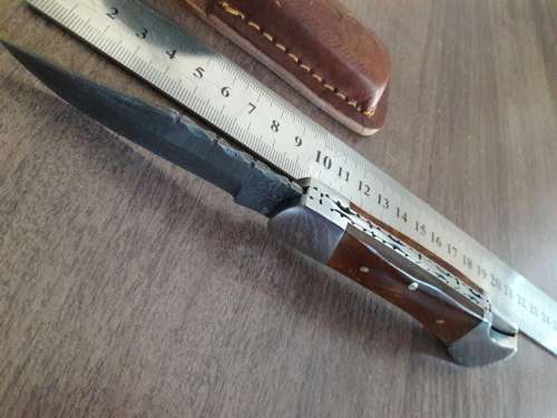 Handmade Damascus steel folding knife with Resin handle scales.