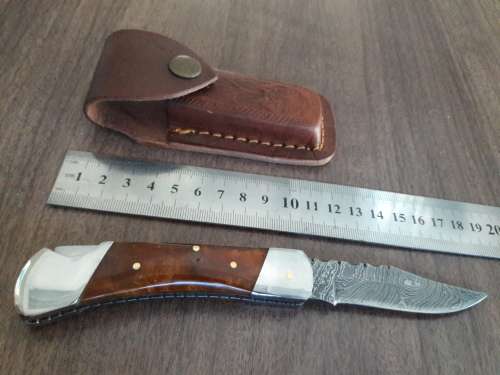 Handmade Damascus steel folding knife with Resin handle scales.