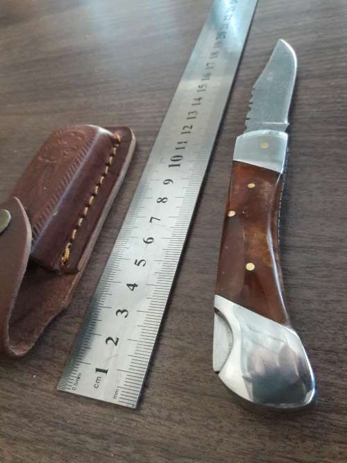 Handmade Damascus steel folding knife with Resin handle scales.