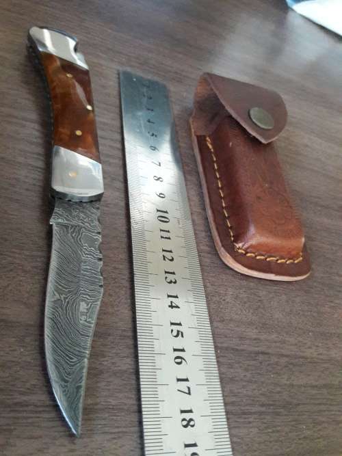 Handmade Damascus steel folding knife with Resin handle scales.