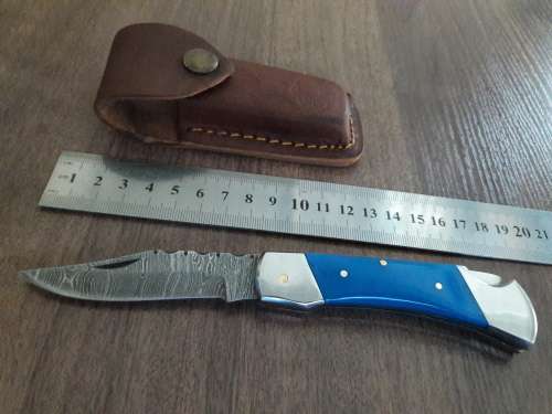 Handmade Damascus steel folding knife with Resin handle scales.