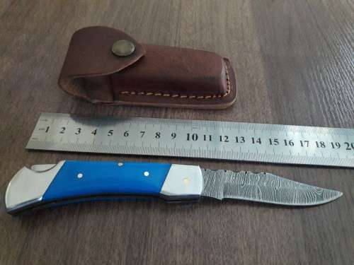 Handmade Damascus steel folding knife with Resin handle scales.