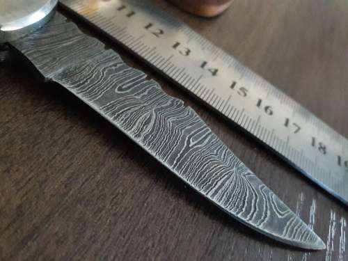 Handmade Damascus steel folding knife with Resin handle scales.
