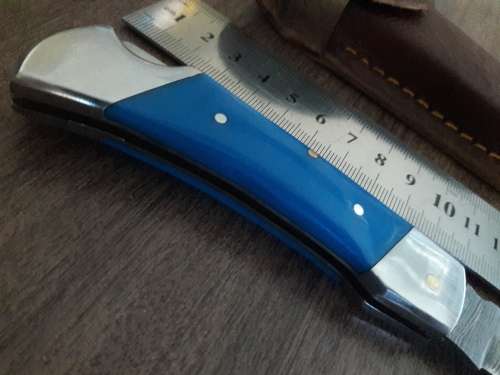 Handmade Damascus steel folding knife with Resin handle scales.