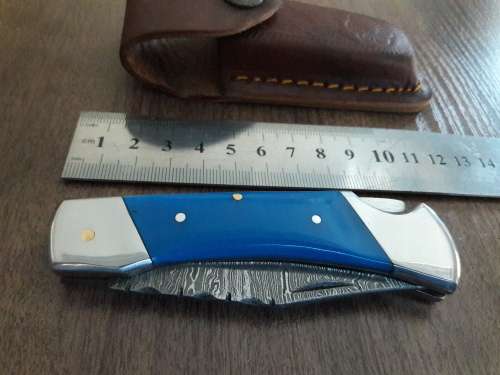Handmade Damascus steel folding knife with Resin handle scales.