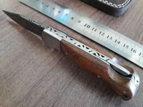 Handmade Damascus steel folding knife with WOODEN handle scales.