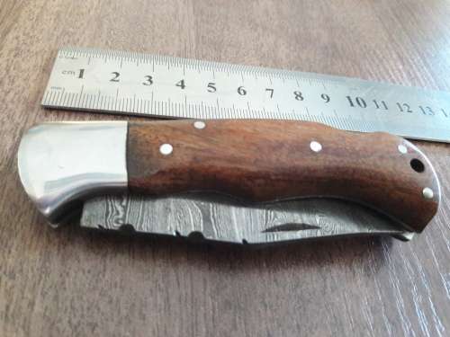 Handmade Damascus steel folding knife with WOODEN handle scales.