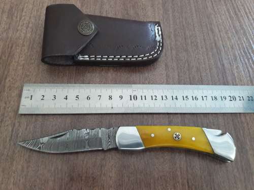 Handmade Damascus steel folding knife with CAMEL BONE handle scales.