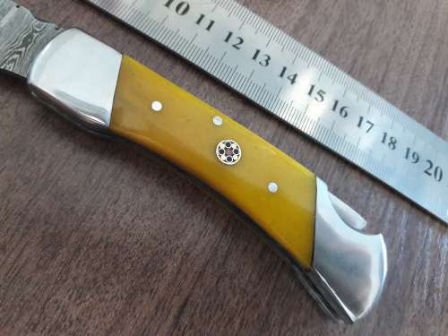 Handmade Damascus steel folding knife with CAMEL BONE handle scales.