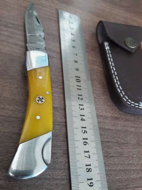 Handmade Damascus steel folding knife with CAMEL BONE handle scales.
