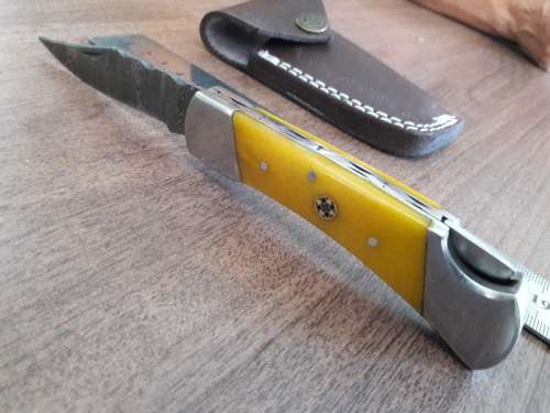 Handmade Damascus steel folding knife with CAMEL BONE handle scales.