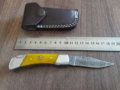 Handmade Damascus steel folding knife with CAMEL BONE handle scales.