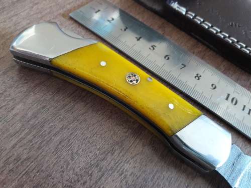 Handmade Damascus steel folding knife with CAMEL BONE handle scales.