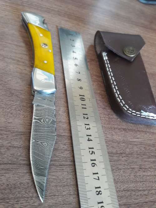 Handmade Damascus steel folding knife with CAMEL BONE handle scales.