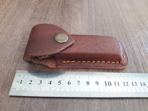 Handmade Damascus steel folding knife with Bull Horn handle scales.