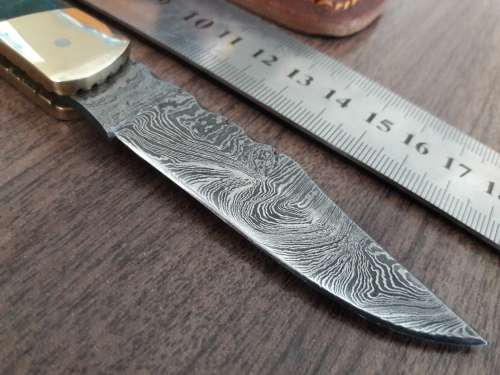 Handmade Damascus steel folding knife with CAMEL BONE handle scales.
