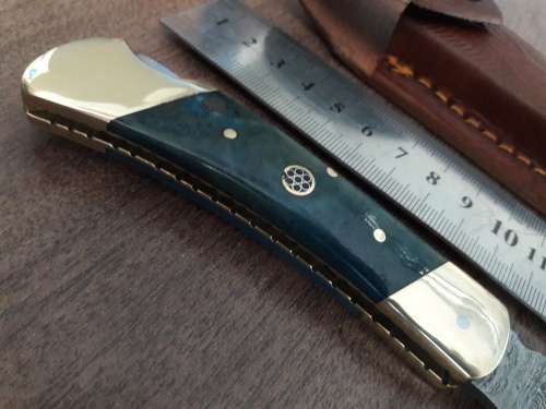 Handmade Damascus steel folding knife with CAMEL BONE handle scales.