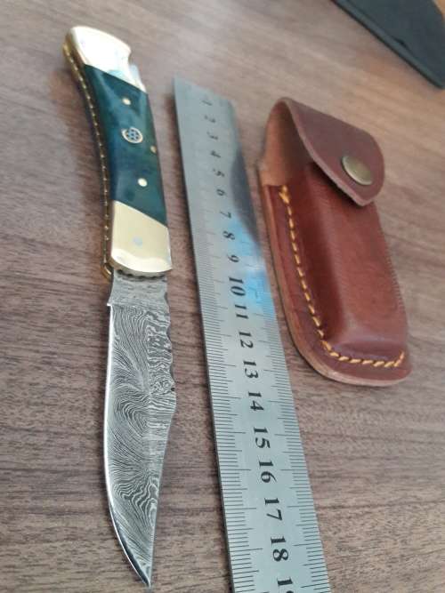 Handmade Damascus steel folding knife with CAMEL BONE handle scales.