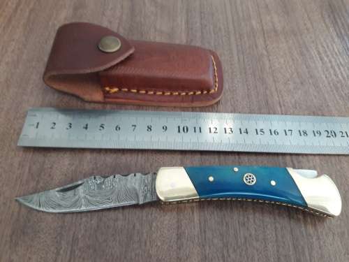 Handmade Damascus steel folding knife with CAMEL BONE handle scales.