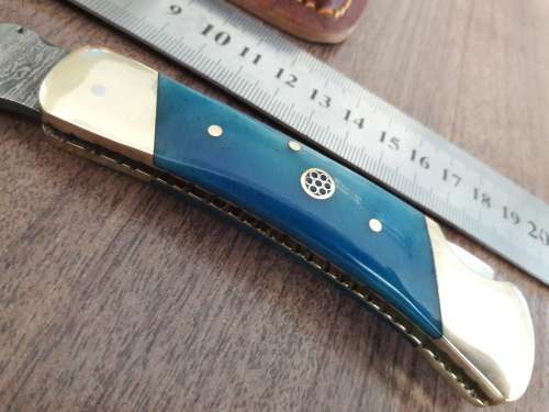 Handmade Damascus steel folding knife with CAMEL BONE handle scales.
