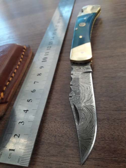 Handmade Damascus steel folding knife with CAMEL BONE handle scales.