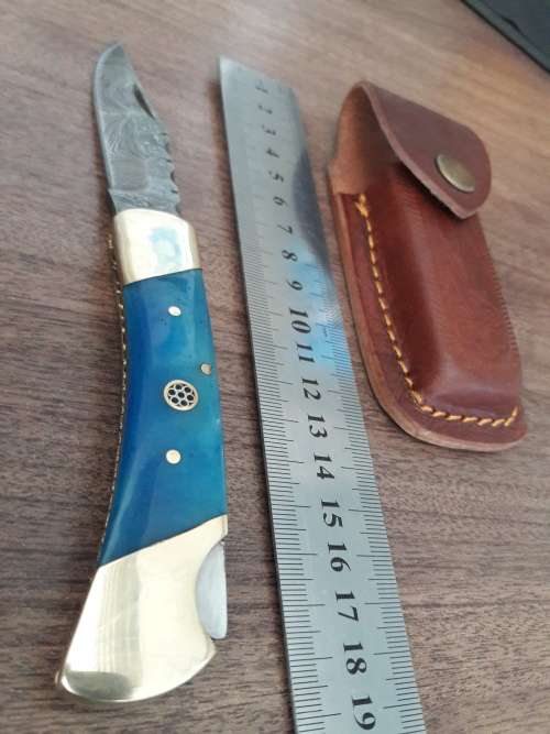 Handmade Damascus steel folding knife with CAMEL BONE handle scales.