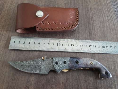 Handmade Damascus steel folding knife with Camel Bone handle scales.