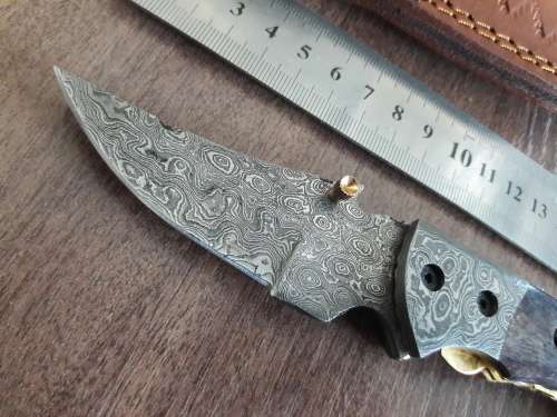 Handmade Damascus steel folding knife with Camel Bone handle scales.