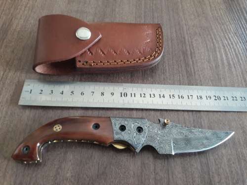 Handmade Damascus steel folding knife with Camel Bone handle scales.