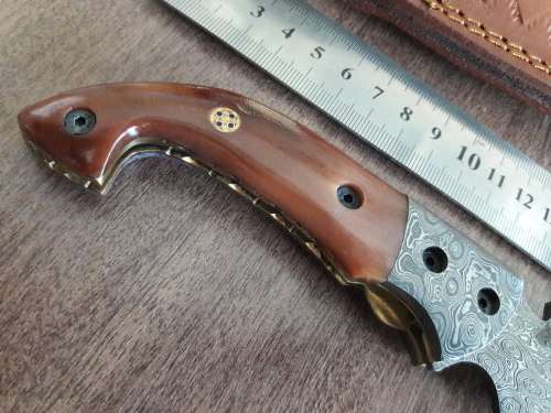 Handmade Damascus steel folding knife with Camel Bone handle scales.