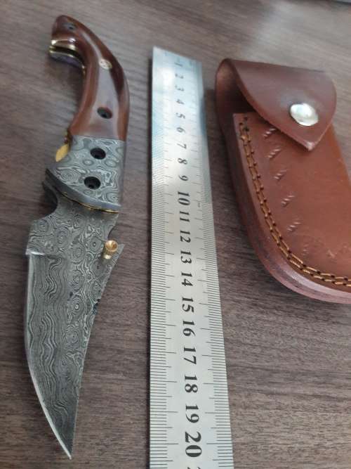 Handmade Damascus steel folding knife with Camel Bone handle scales.