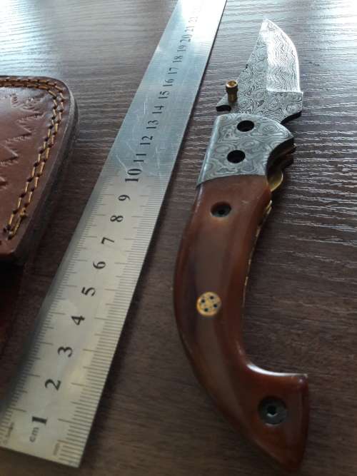 Handmade Damascus steel folding knife with Camel Bone handle scales.