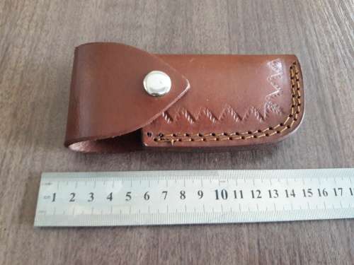 Handmade Damascus steel folding knife with Camel Bone handle scales.
