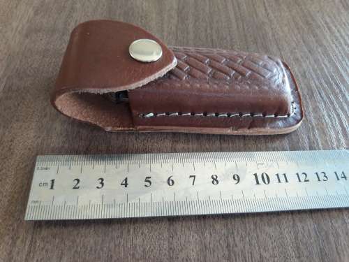 Handmade Damascus steel folding knife with Wooden handle scales.