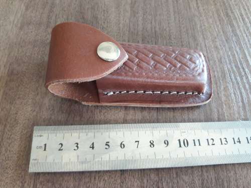 Handmade Damascus steel folding knife with Burnt Camel Bone handle scales.