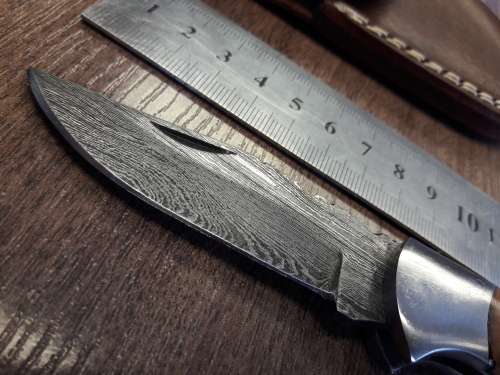 Handmade Damascus steel folding knife with Wooden handle scales.