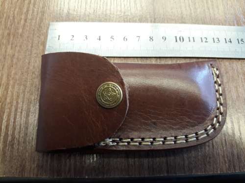 Handmade Damascus steel folding knife with Wooden handle scales.
